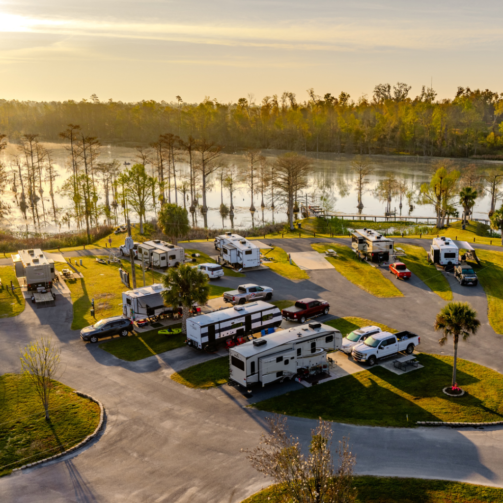 Overhead drone shot of the deluxe rv sites at Florida Caverns RV Resort. The sites overlook merritt's mill pond